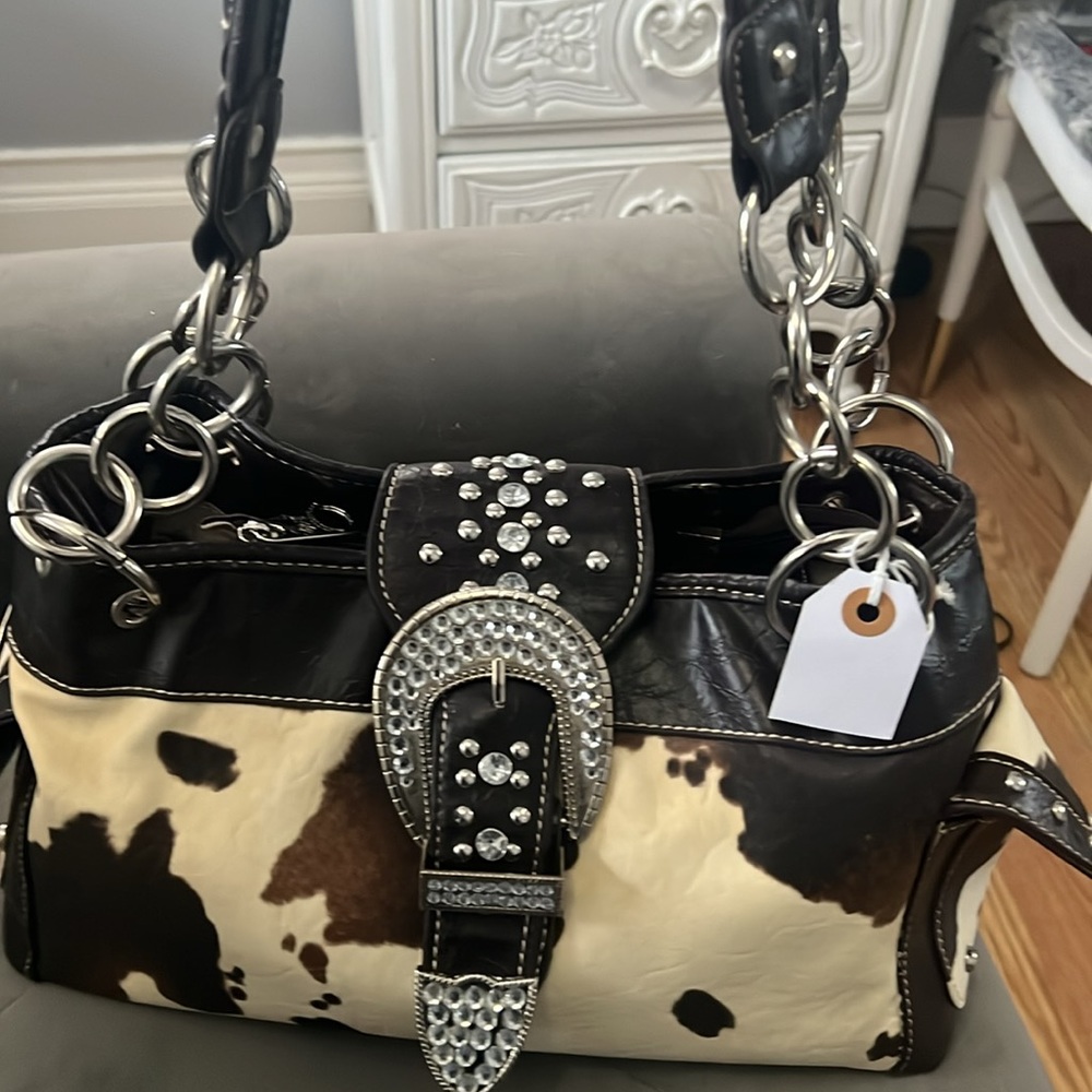 Cow print purse with rhinestone closure